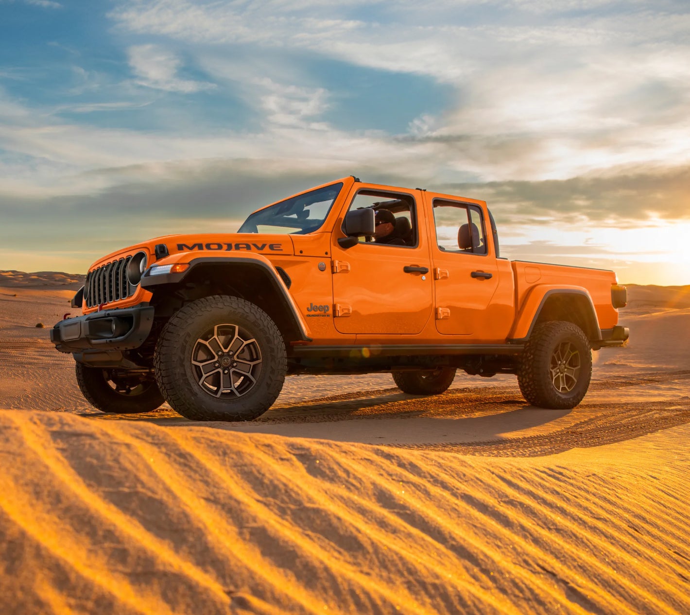 2026 Orange Jeep Gladiator Mojave on Desert Sand Dunes